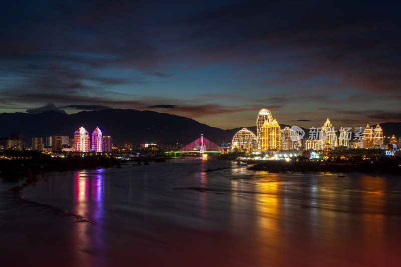 西双版纳景洪市城市河畔夜景璀璨灯光