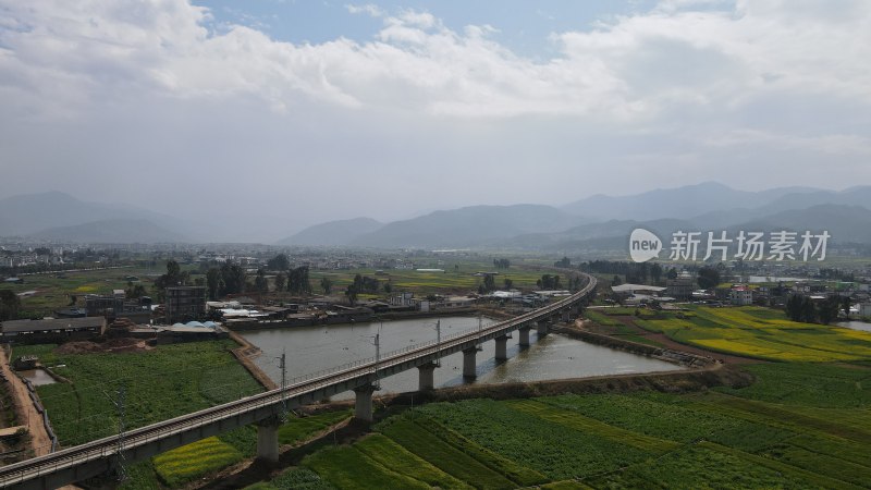 航拍高铁乡村铁路桥与田园风光