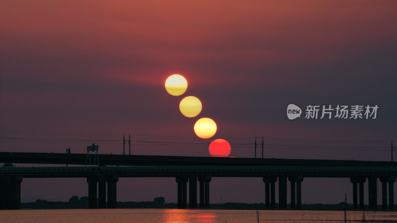 夕阳下桥梁上的多重太阳景象