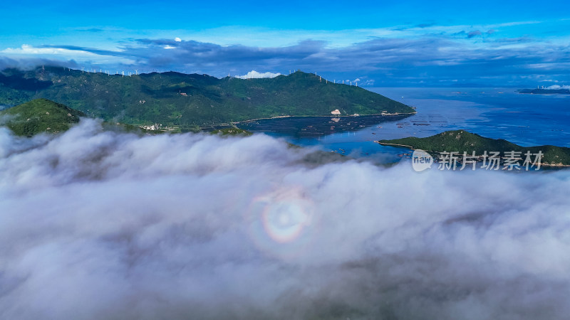 海上岛屿云海佛光美景航拍图