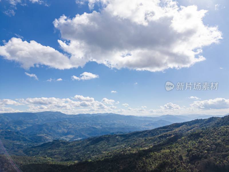 航拍蓝天白云下的景迈山山脉自然风光