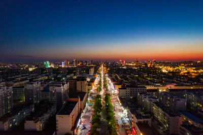 山东东营城市日落晚霞夜景航拍摄影图