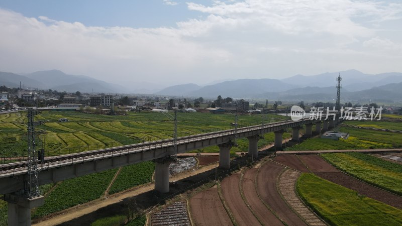 航拍高铁乡村铁路桥与田园风光