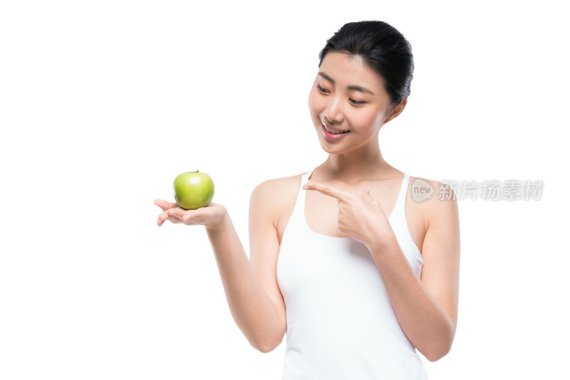 年轻女子手拿苹果