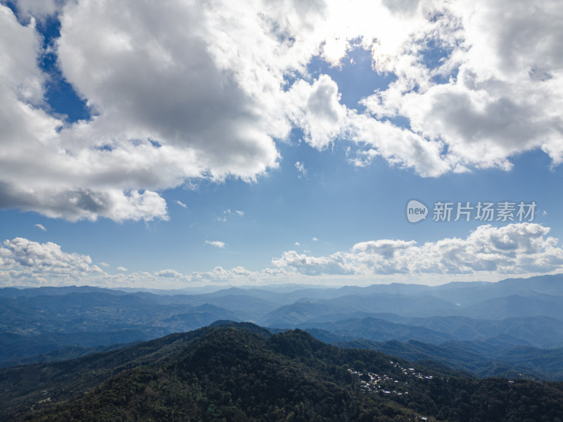 航拍蓝天白云下的景迈山山脉自然风光