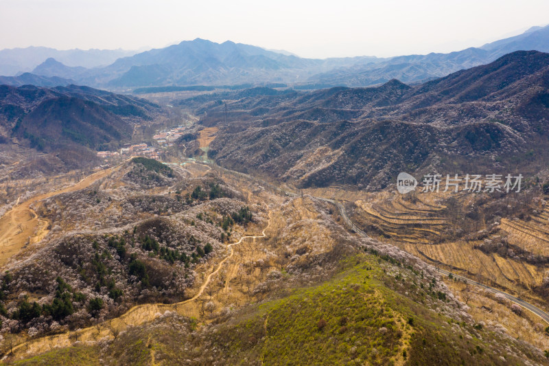 航拍北京春天山区蜿蜒的公路