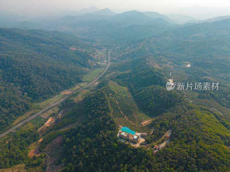 航拍山间高速公路与乡村别墅