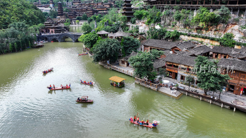 游客旅游贵州兴义峰林布依观赏山水吊脚楼