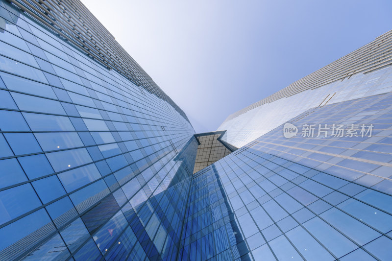 仰拍蓝天下的江苏南京玻璃幕墙高楼