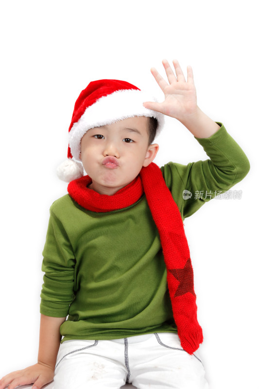 戴圣诞帽搞怪的小男孩