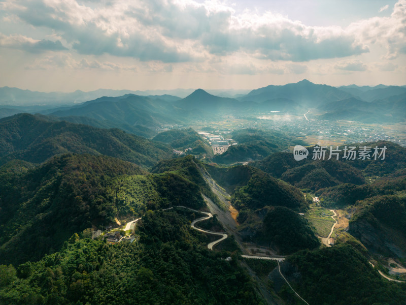 航拍蓝天白云下的青山河流稻田乡村风光