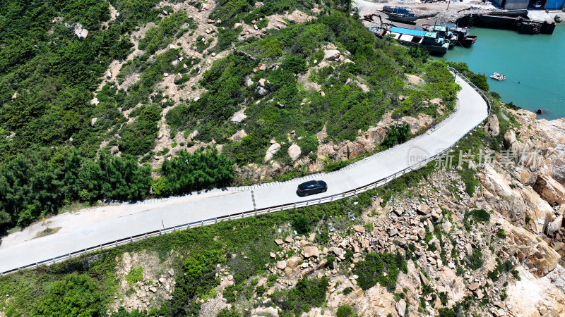 汽车行驶在海边公路航拍风景旅拍旅行自驾游