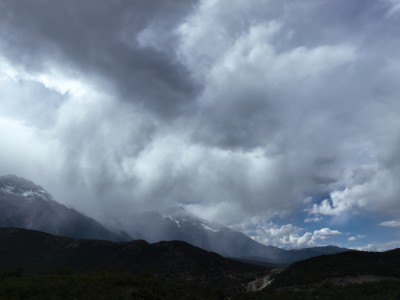 航拍雪山出太阳下大雨