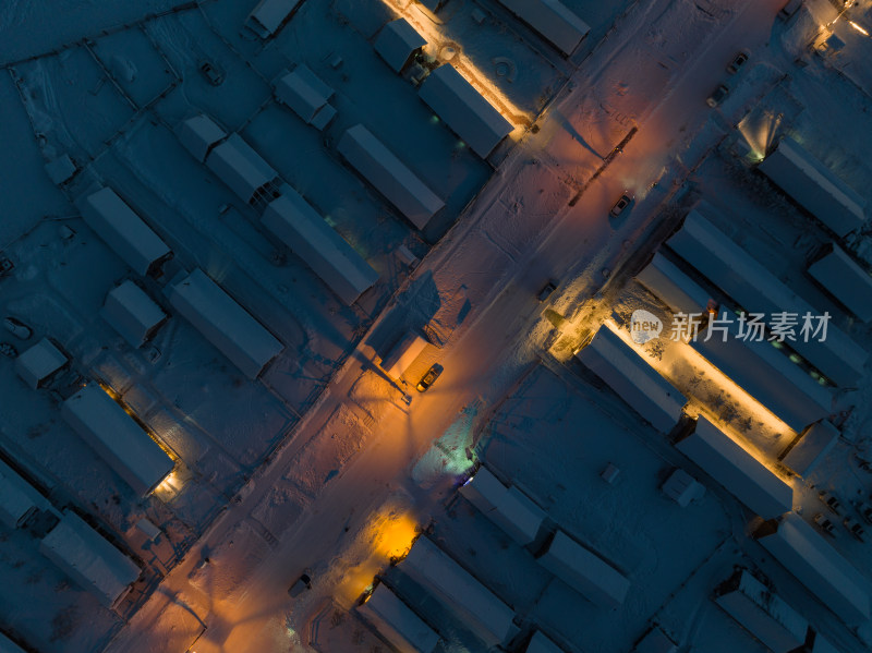 航拍冬季雪后的新疆喀纳斯乡村夜景