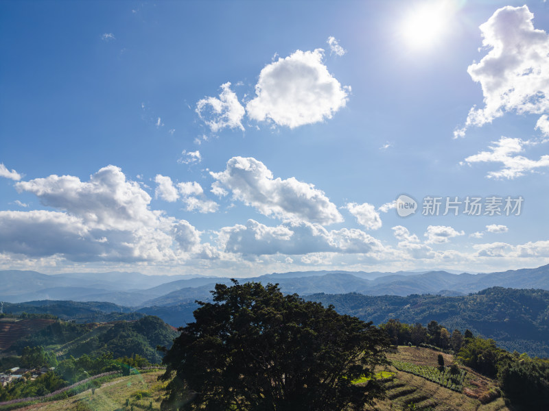 航拍蓝天白云下的景迈山山脉自然风光