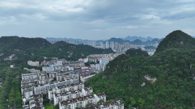 航拍广西柳州鱼峰区居民楼小区喀斯特地貌山