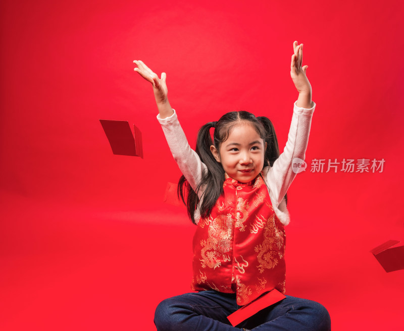 红色背景前中国女孩空中有多个红包