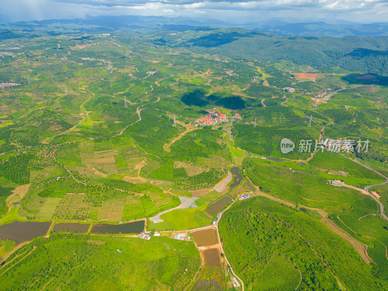 航拍天空高山草甸山脉田园村寨风光