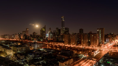 北京月光下灯火辉煌的城市夜景俯瞰图