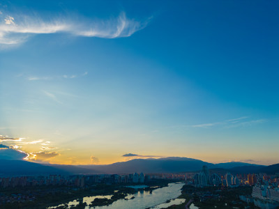 航拍日落时西双版纳景洪市城市风光