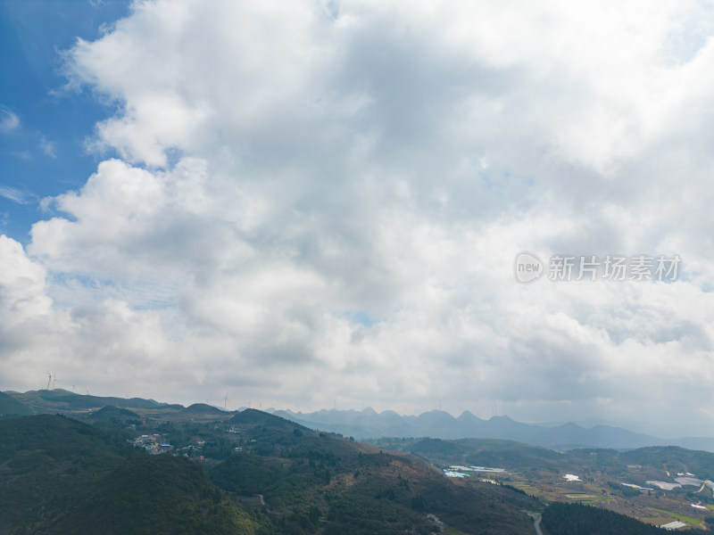 航拍蓝天白云下的山脉自然风光