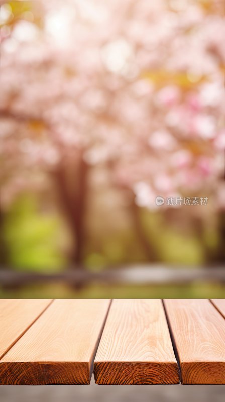 木质桌面和模糊的樱花背景