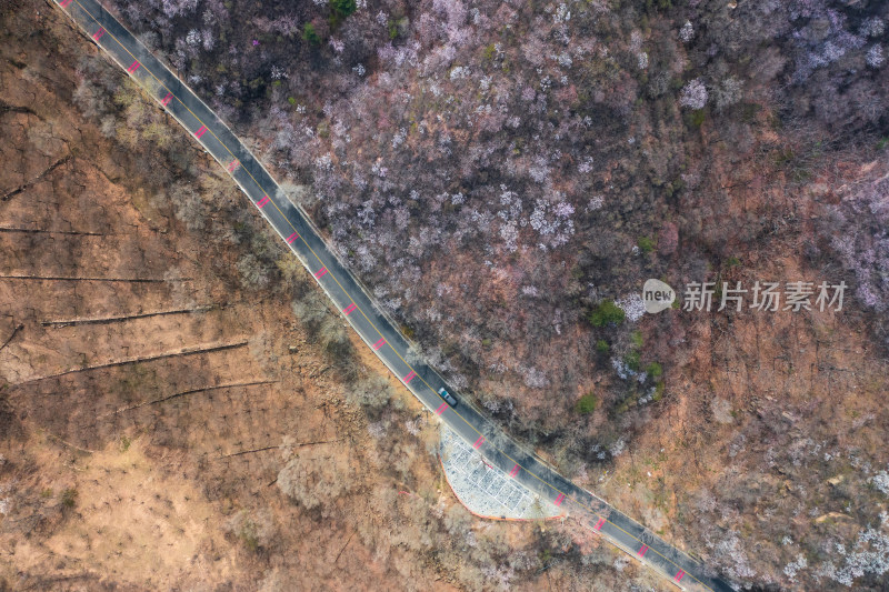 航拍北京春天山区蜿蜒的公路