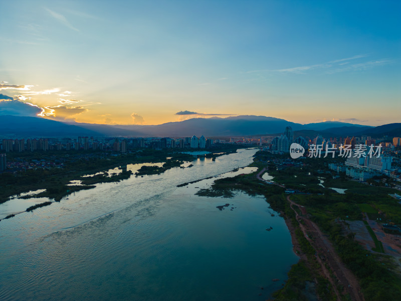 航拍日落时的西双版纳景洪市城市风光