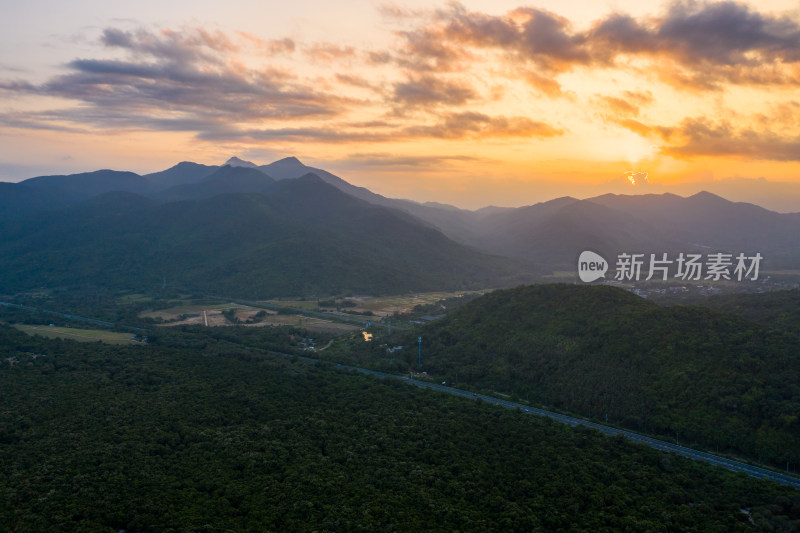 航拍海南万宁高速日落山脉风光