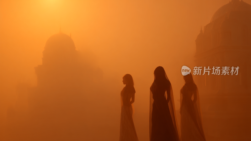 夕阳下三位身着纱裙女性的剪影