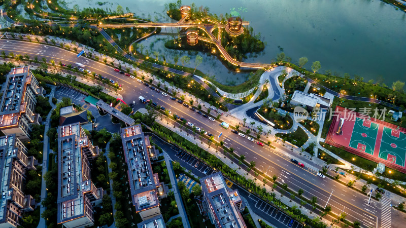 城市湖畔道路及建筑夜景航拍