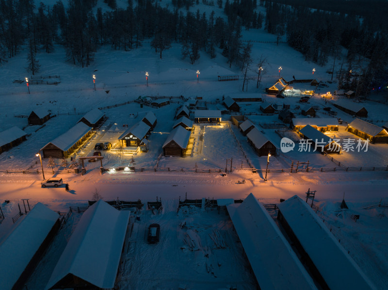 航拍冬季雪后的新疆喀纳斯乡村夜景