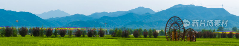 农村田野山脉水车风景全景