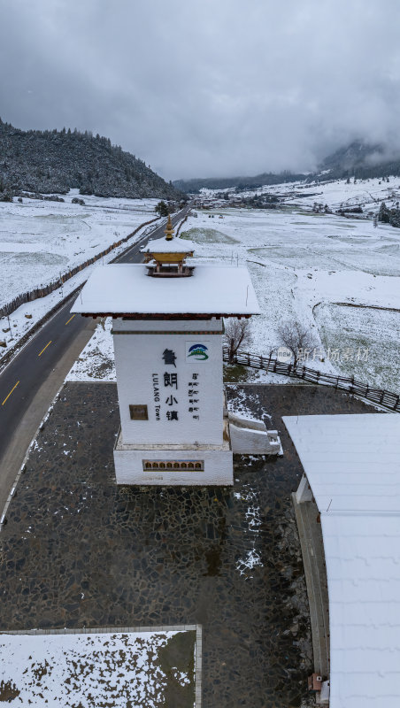 西藏林芝地区鲁朗小镇雪景高空航拍