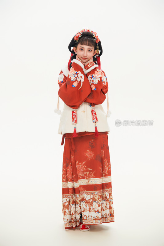 白色背景下身穿喜庆中式汉服的可爱少女