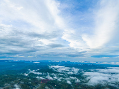 航拍雨后云雾中朦胧的山景