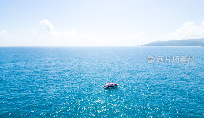 海南三亚高视角航拍大海与行驶的帆船